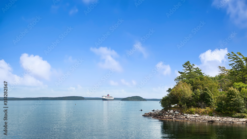 Panoramic view of Bar Harbor with cruise ship and cluster of small islands in Acadia National Park, Maine USA