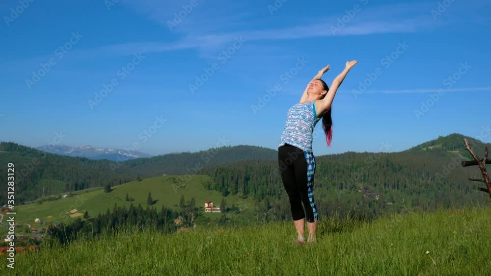 Girl doing yoga in the mountains Girl doing yoga in the mountains