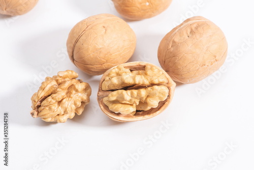 A pile of walnuts isolated in a white background.