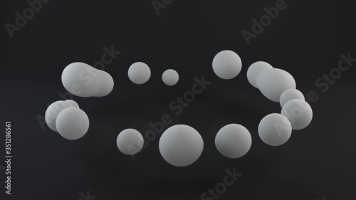 3D animation of a white sphere dividing into many drops moving in a circle and merging with each other. Abstract 4K animation with continuous playback.