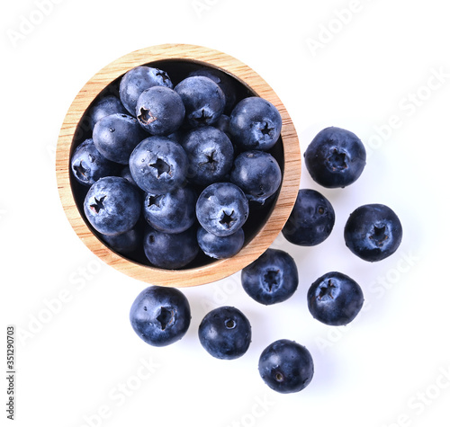 Blueberry in a wooden cup Isolated on a white background. Top view