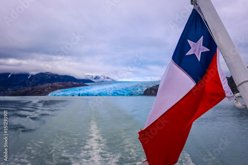 Chilean Flag with the Background View to the Glacier Gray, Chile