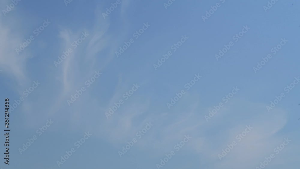 Beautiful sunny blue sky background with Wispy smoke clouds or cirrus & cirrostratus cloudscape slowly moved above daylight horizon in tropical summer or spring morning sunlight, B-roll TimeLapse Beautiful sunny blue sky background with Wispy smoke clouds or cirrus & cirrostratus cloudscape slowly moved above daylight horizon in tropical summer or spring morning sunlight, B-roll TimeLapse