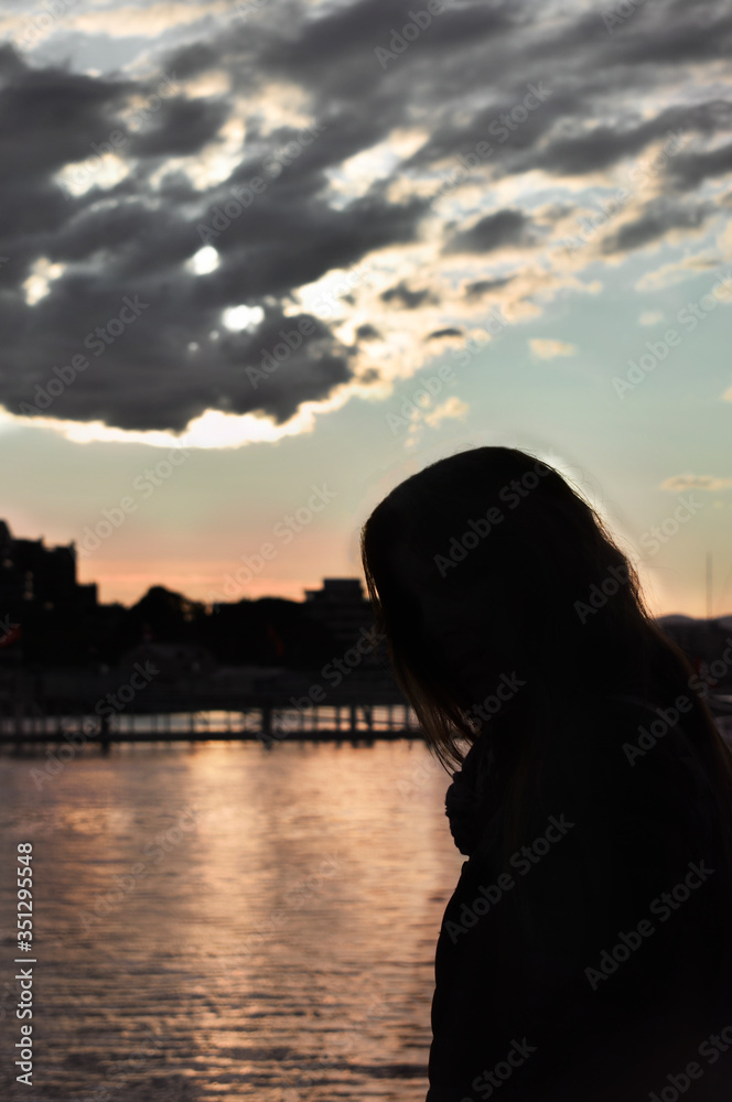 Fototapeta premium sunset silhouette of a woman
