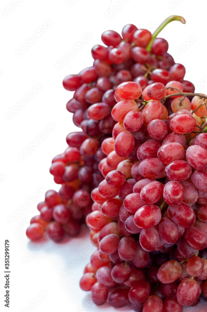 Bunch red grape on white background.