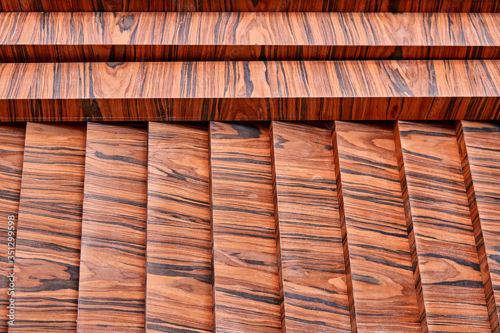 Joinery. Wood veneer wall panels elements are covered with dust