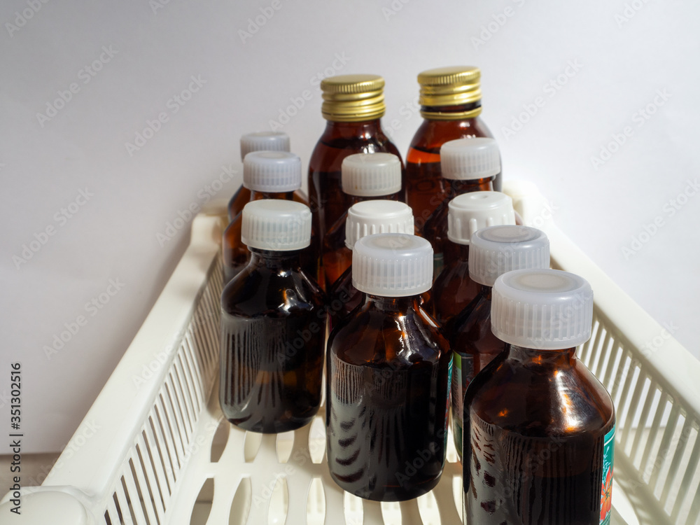 Dark glass bottles with antiseptics, herbal tinctures and other liquid ...