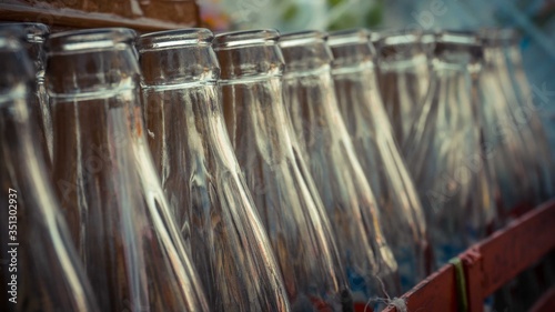 Rows of glass of empty bottle in the crate