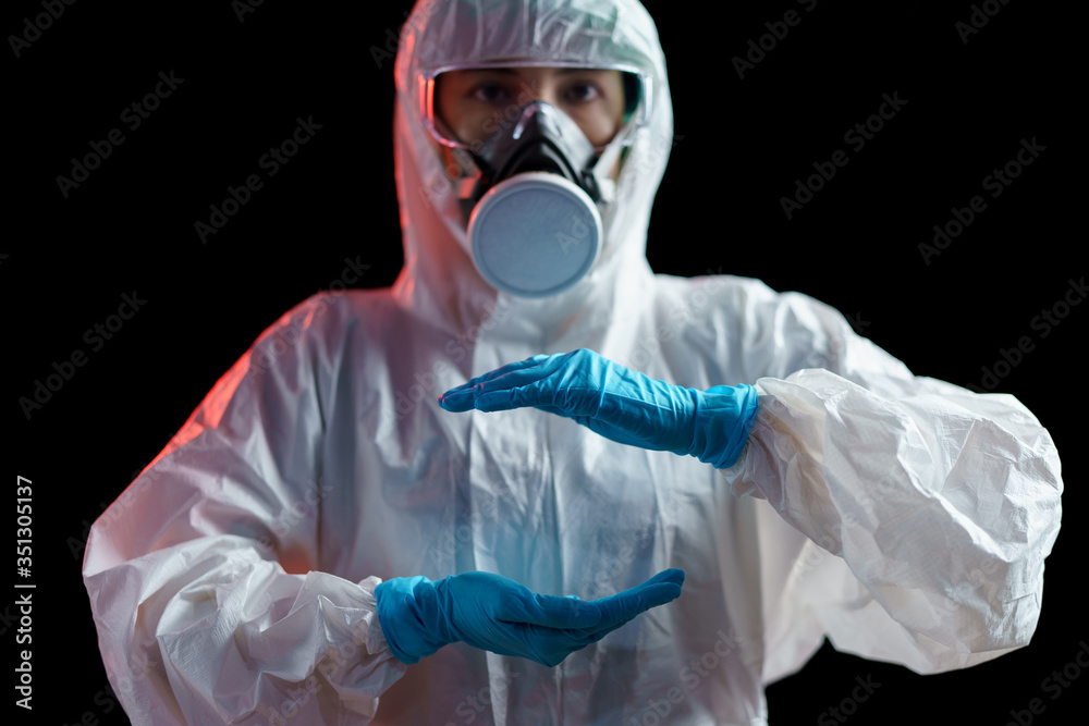 Woman in hazmat suit with empty between two Hands Woman in hazmat suit with empty between two Hands