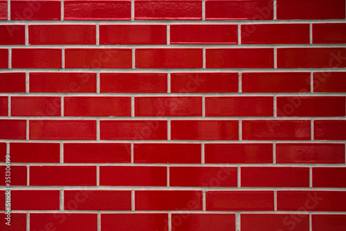 Red stone or brick wall texture and background, close up