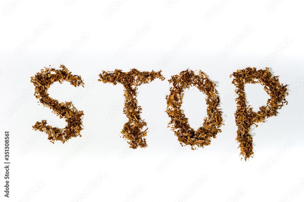 Stop sign made of tobacco for cigarettes on a white background, harm, Smoking ban. Stop sign made of tobacco for cigarettes on a white background, harm, Smoking ban.