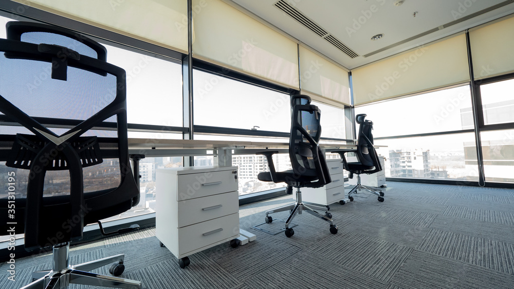 Fototapeta premium View of empty office with three office chairs