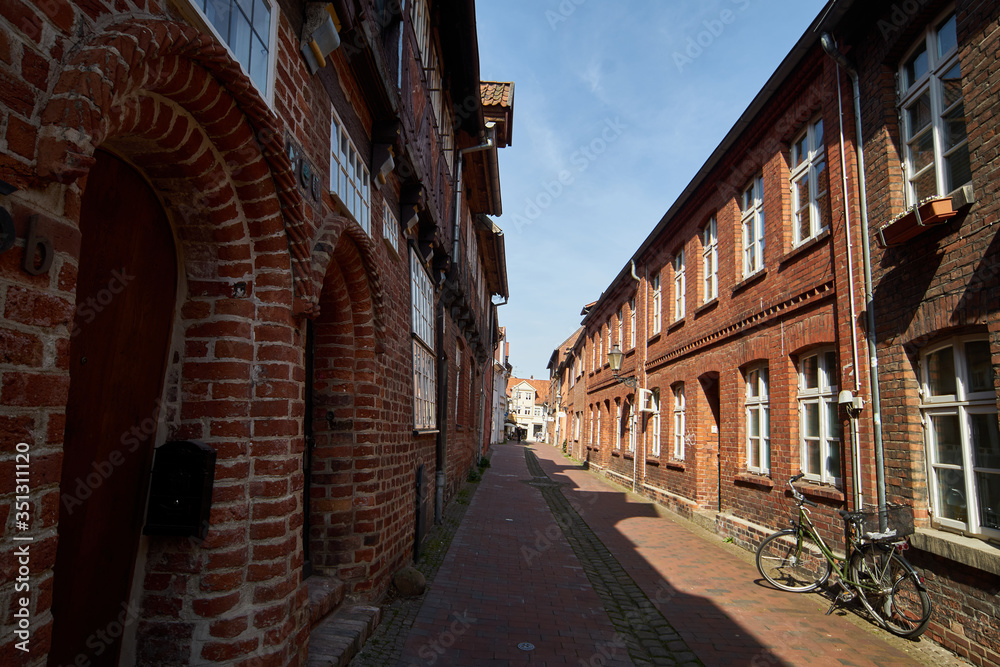 Narrow alley with brick houses in a northern German old town
