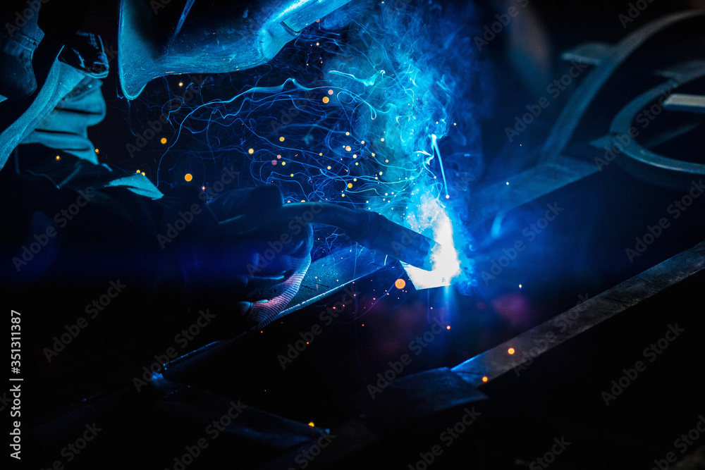 Welder during work , light , sparks , welding Welder during work , light , sparks , welding