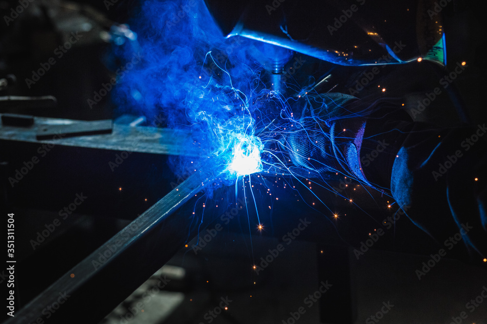 Welder during work , light , sparks , welding Welder during work , light , sparks , welding