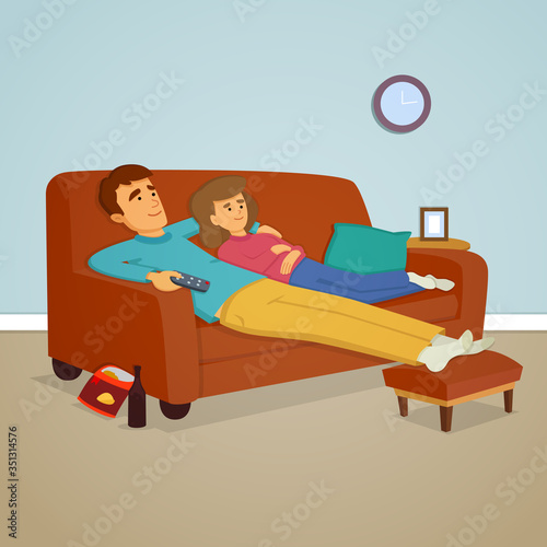 Couple relaxing on sofa watching TV