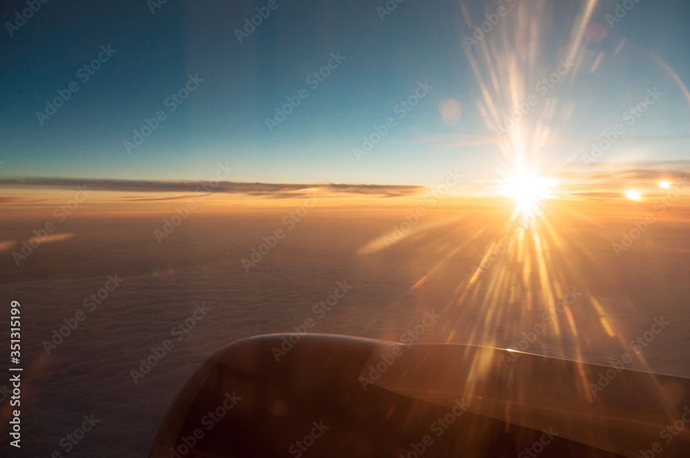 View from the window of the plane on the evening sky..Holidays in 2018.