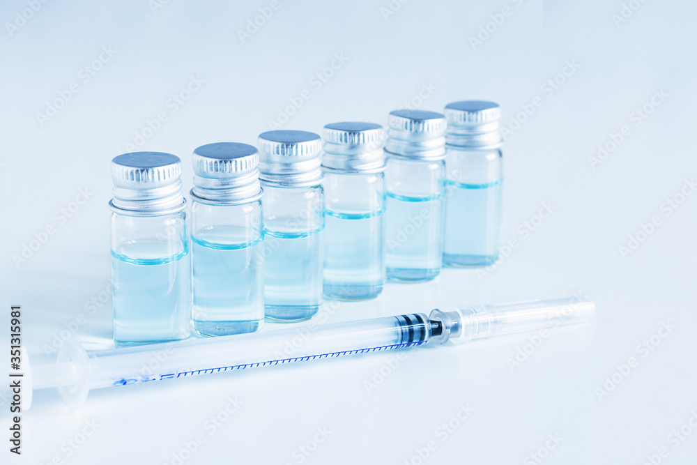Medical glass vials and syringe for vaccination. Medical glass vials and syringe for vaccination.