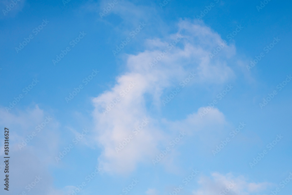 Beautiful texture - clouds on blue sky with a copy space for text