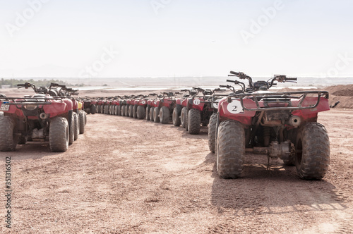 Riding a quad bike in the desert near the Sinai Mountains. Sharm El Sheikh. Photo on a sunny day..Holidays in 2018.