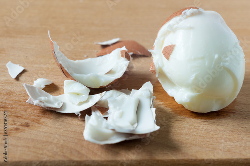 slices of peeled egg and shell on the Board