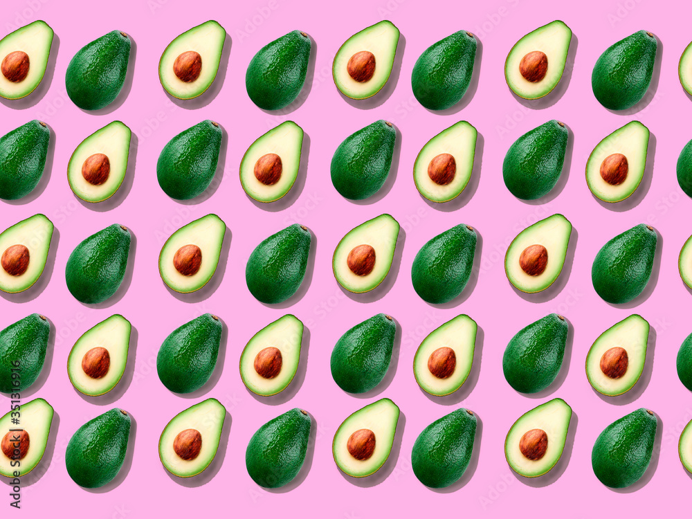 Seamless background with avocado on pink.