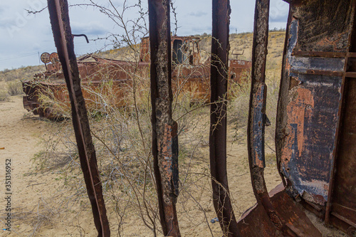 Rusty ships at the ship graveyard in former Aral sea  port town Moynaq (Mo‘ynoq or Muynak), Uzbekistan photo