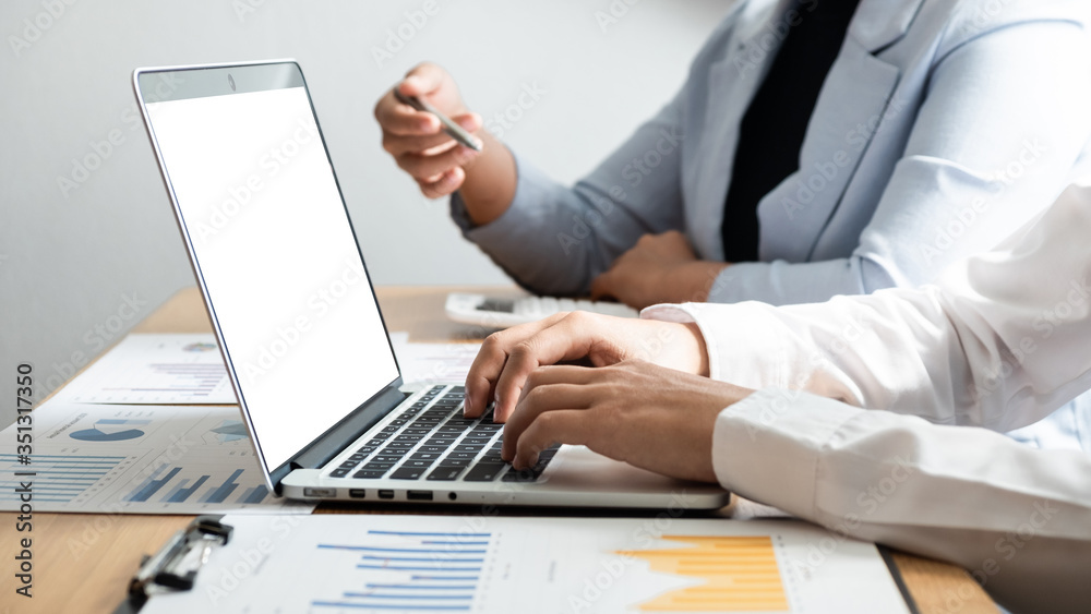 Businessman are using computer notebook and discussing about business graph with another business people in the office. Businessman are using computer notebook and discussing about business graph with another business people in the office.