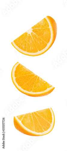 Orange pieces. Cut oranges on white background. Isolated.