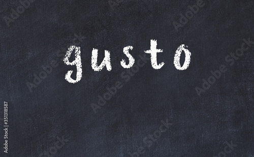 College chalk desk with the word gusto written on in