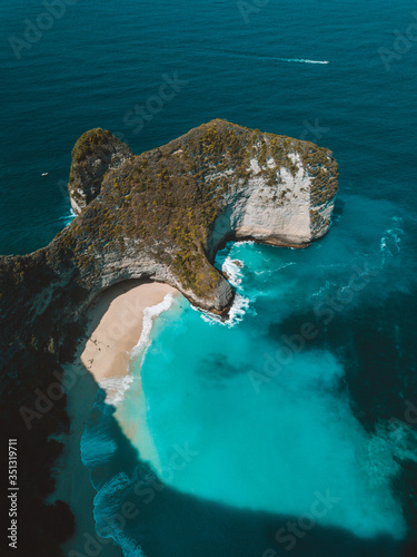 Aerial view of Kelinking beach in Nusa penida, at high tide at 10 am photo