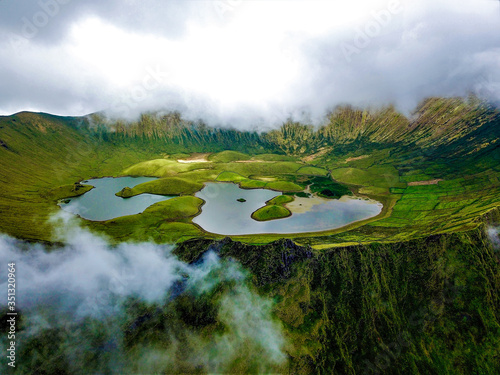 Aerial view of Caldeir„o volcano crater on Corvo Island, Azores, Portugal. photo