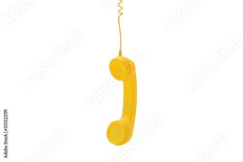 Yellow handset isolated on white. © Nikolay