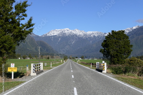 On Highway SH6 in New Zealand towards the Mount Cook Mountain Range between Greymouth and the Franz Josef Glacier Village