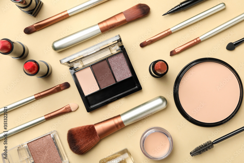Different makeup cosmetics on beige background. Female accessories Different makeup cosmetics on beige background. Female accessories
