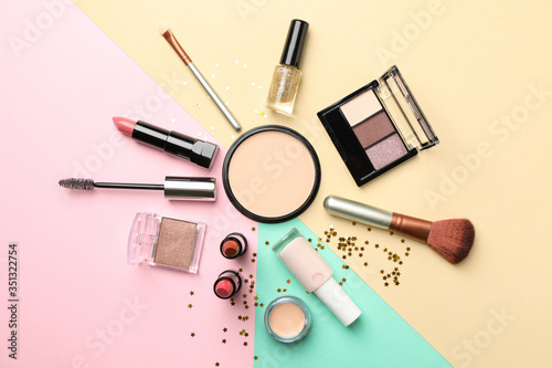 Different makeup cosmetics on color background. Female accessories
