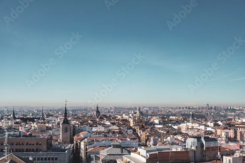 image of the buildings of the city of Madrid from the heights with a slightly polluted blue sky