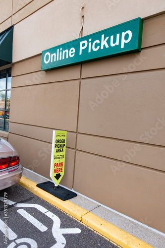 Sign showing where cars should park to pick up ordered groceries, keeping social distance during the COVID-19 pandemic. St Paul Minnesota MN USA