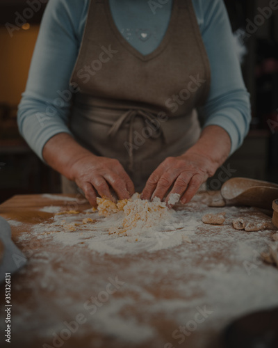 grandmother prepares fresh homemade pasta