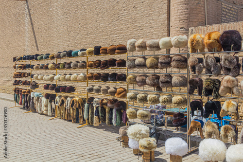 Fur hats for sale at the Pahlavon Mahmud street in the old town of Khiva, Uzbekistan photo