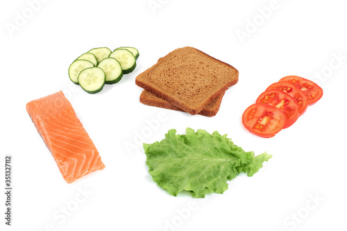 Ingredients for making sandwich. Salmon, fresh vegetables, cucumber, tomatoes, bread,. Isolated on white background, photo