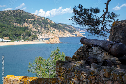 Old stone fortress cannon overlooking the Mediterranean coast