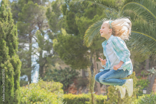 Summertime fun. little girl enjoying vacation. © Vladimir