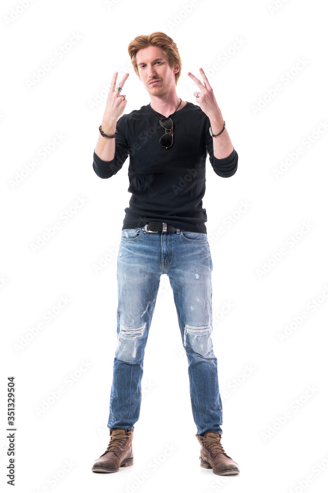 Macho young unshaven red hair man showing two fingers peace signs with both hands. Full body length isolated on white background. Macho young unshaven red hair man showing two fingers peace signs with both hands. Full body length isolated on white background.
