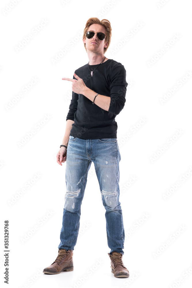 Confident self assured man pointing finger on side showing copy space. Full body length isolated on white background. Confident self assured man pointing finger on side showing copy space. Full body length isolated on white background.
