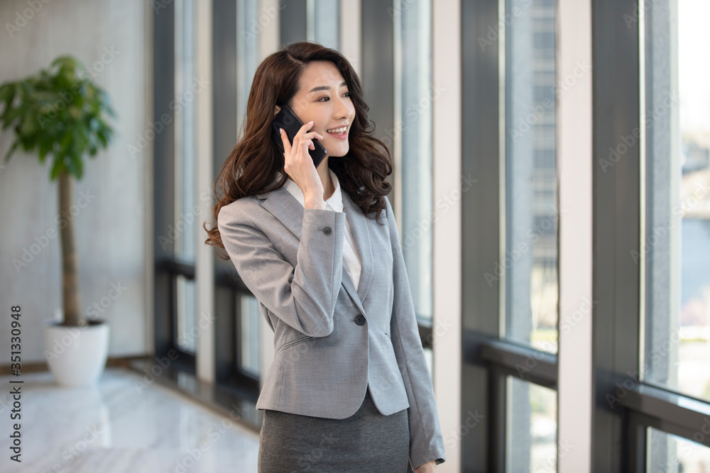 Young businesswoman using smartphone Young businesswoman using smartphone