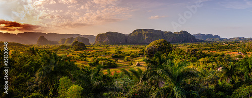 Panorama of Viñales mountains and valley, Cuba. Photo panoramic during sunset at a high point overviewing valley. photo