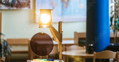 Schooling concept: Retro overhead projector in classroom, educational system photo