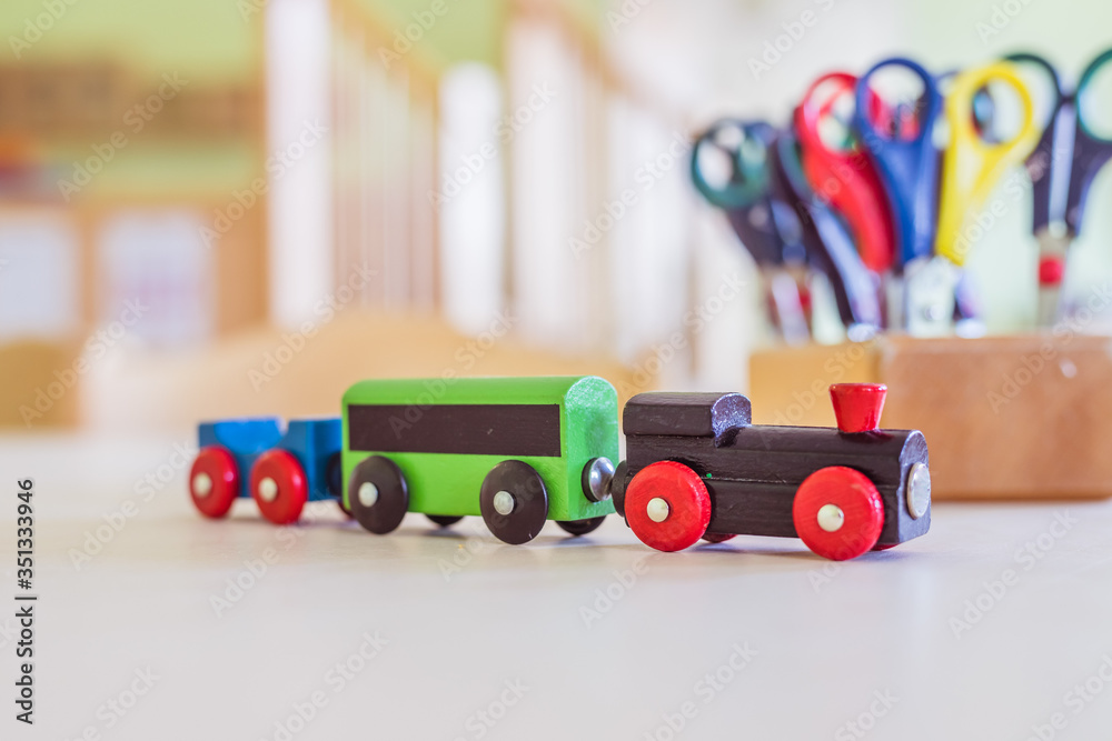 Fototapeta premium Children development concept: Close up of wooden toy railroad in the kindergarten