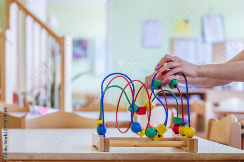 Childhood and socialization concept: Colorful wooden toy in the kindergarten photo